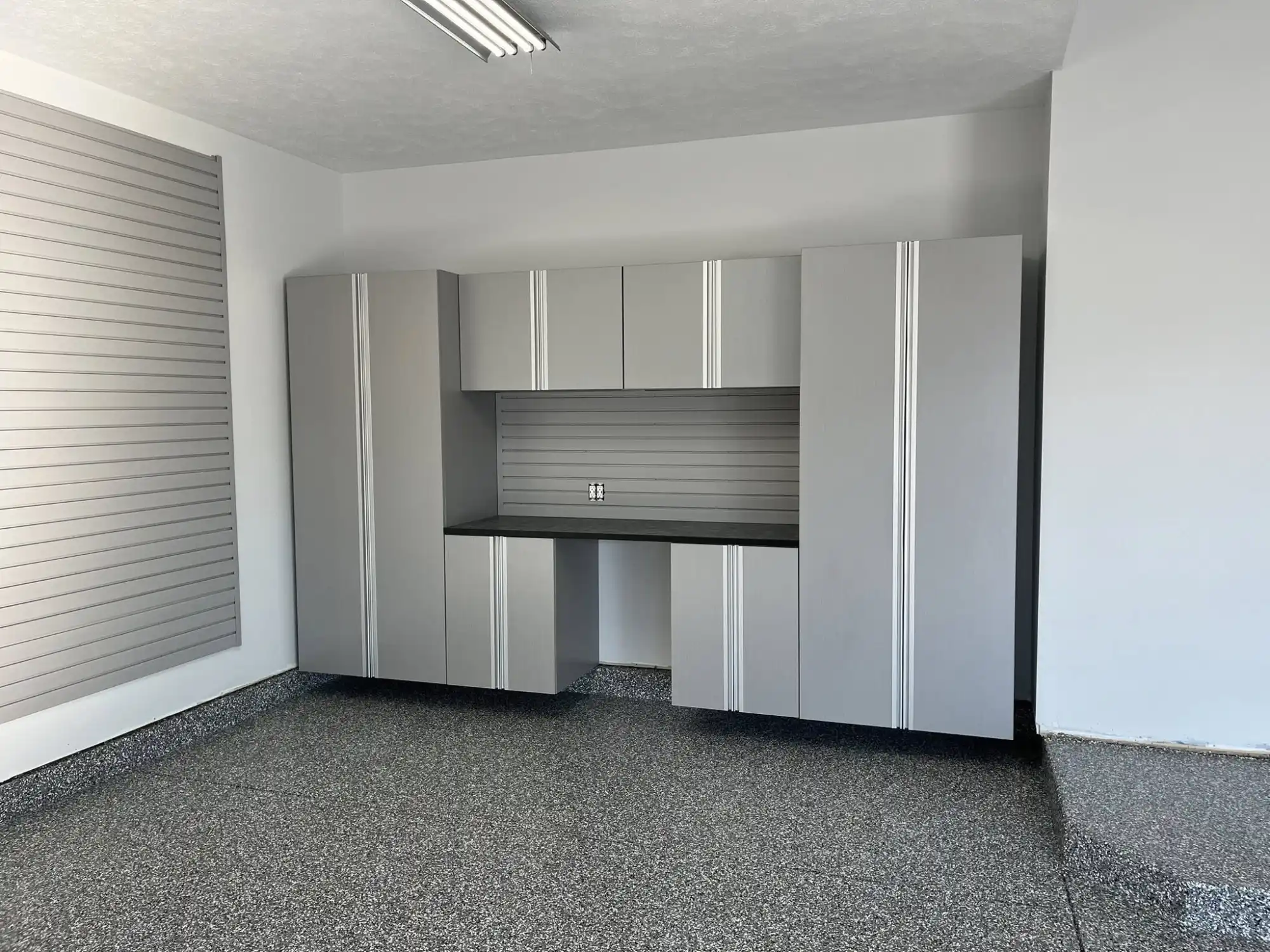 Home cabinets, wall slats, and floor sealing surface built by Mammoth Surface