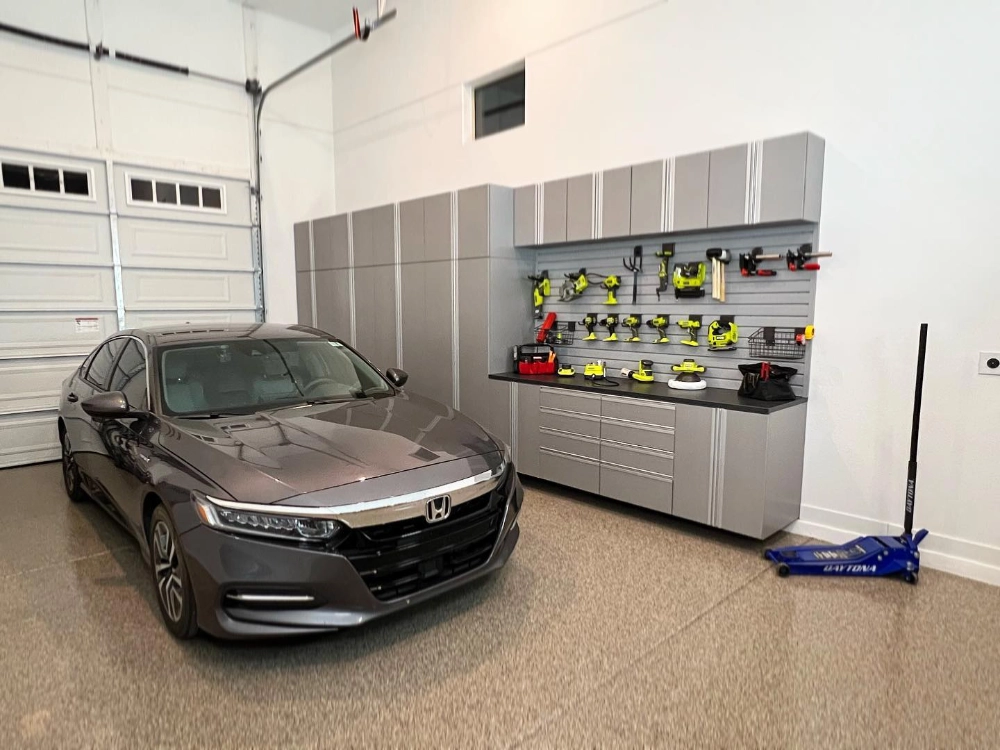 Slat wall and accessory mounts with a car in a garage